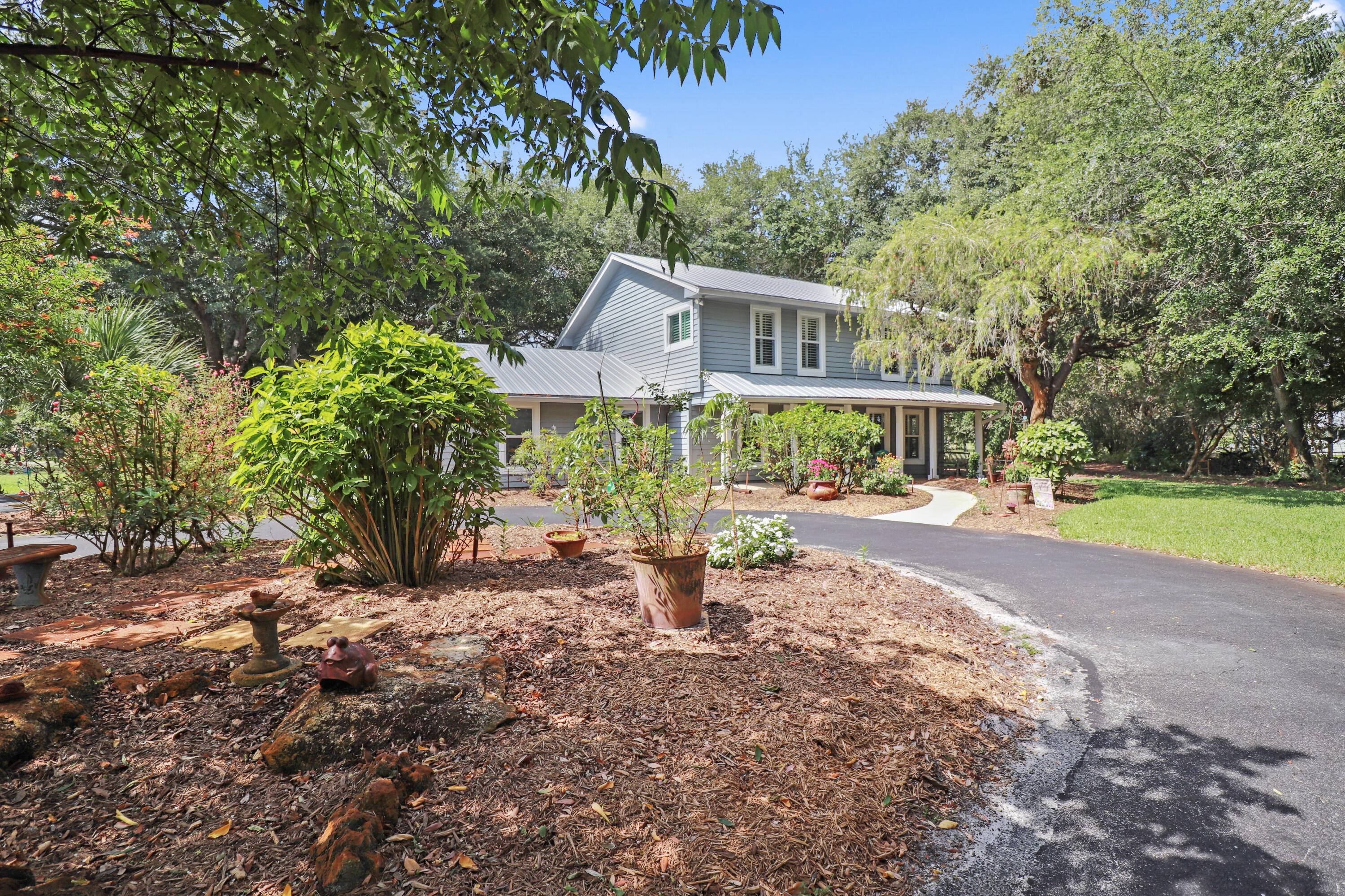 This private 2 story home is a gardener's paradise !