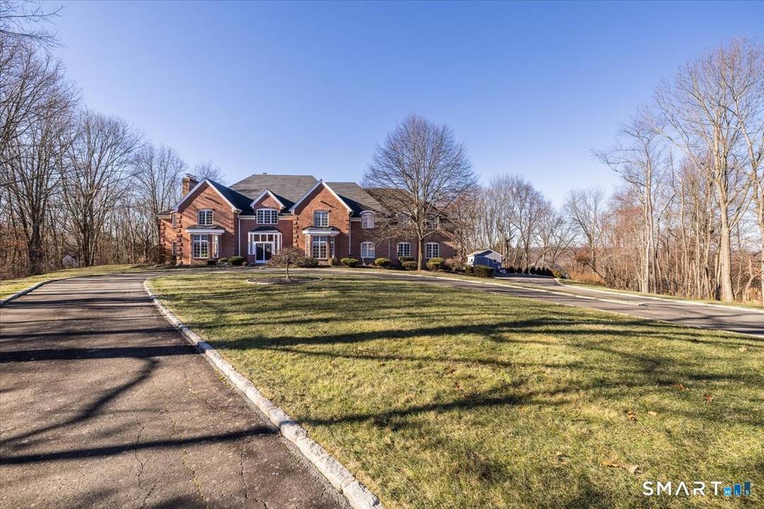 Set on a quiet cul de sac in the highly coveted Quaker Farms neighborhood, this exceptional custom Brick Colonial offers a rare combination of privacy, scale, and timeless elegance.