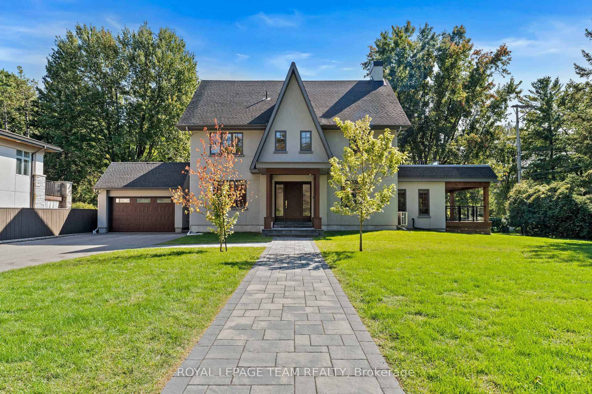 Perched on a prestigious elevated street, this remarkable property features a spacious front yard with desirable south and west facing exposure.
