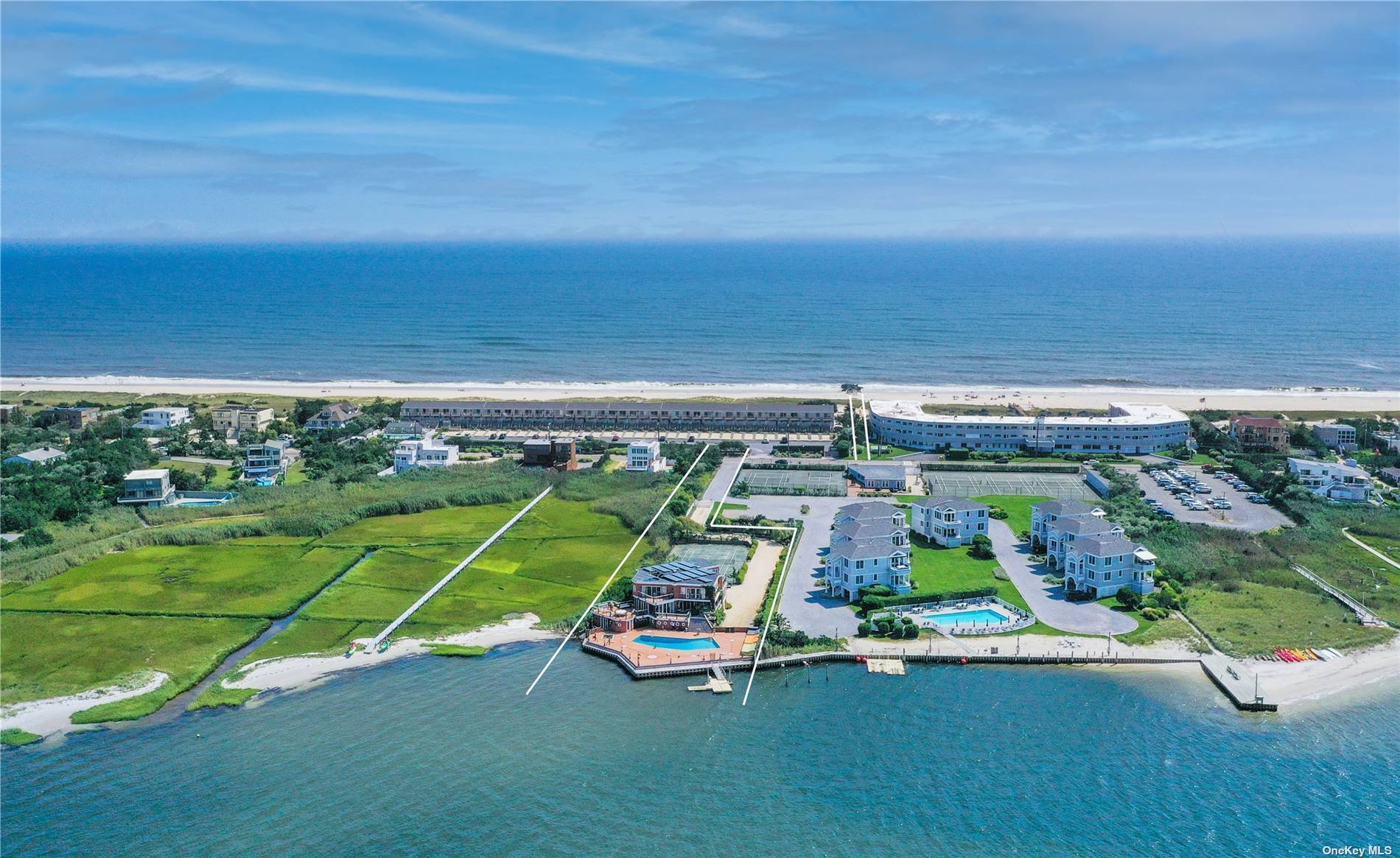 This beach house is an Open Bay stunner with 5 bedrooms and 5 full baths with sweeping water views from every room.