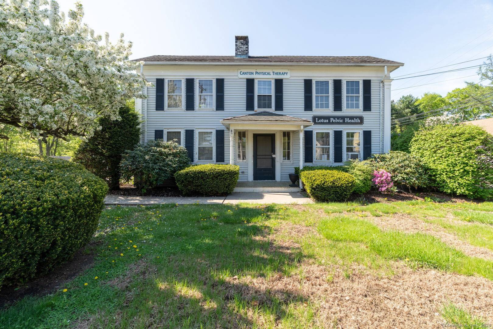 Charming and versatile property in the heart of Canton, CT, offering exceptional versatility and high visibility from Route 44 right across from Canton Green.