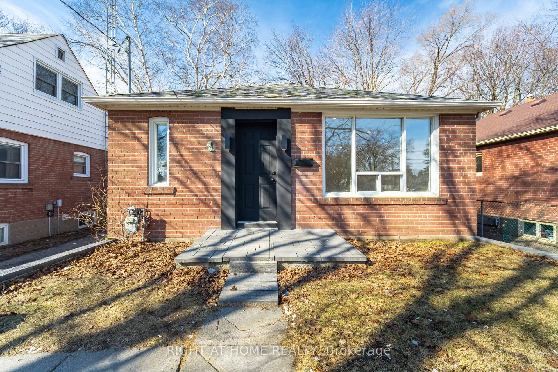 Completely Renovated 2 1 Bedroom Bungalow, featuring an open concept layout with stainless steel appliances.