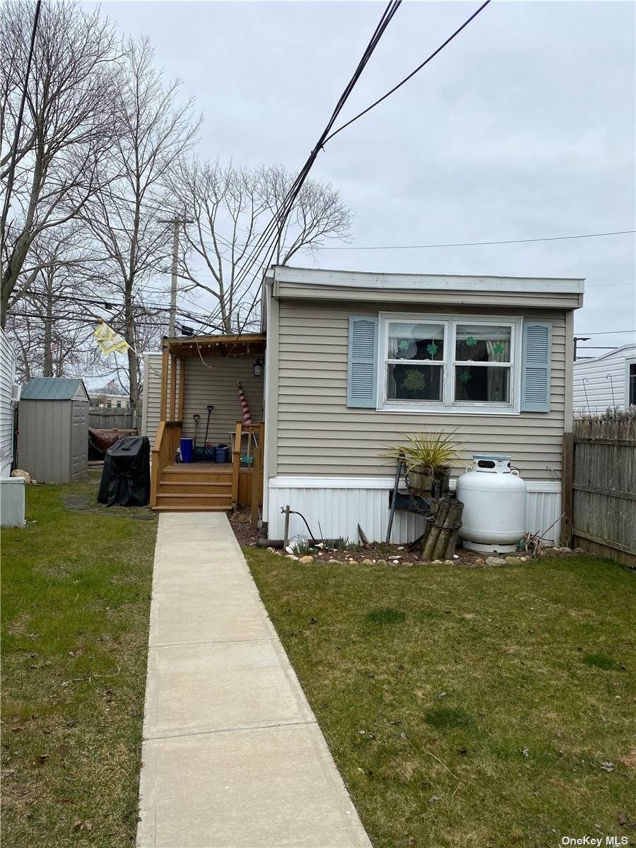 Meticulous, Expanded 2 Bedroom, 1 Bathroom Mobile Home For Sale With Large amp ; Bright Living Room with Skylights and Formal Dining Room.