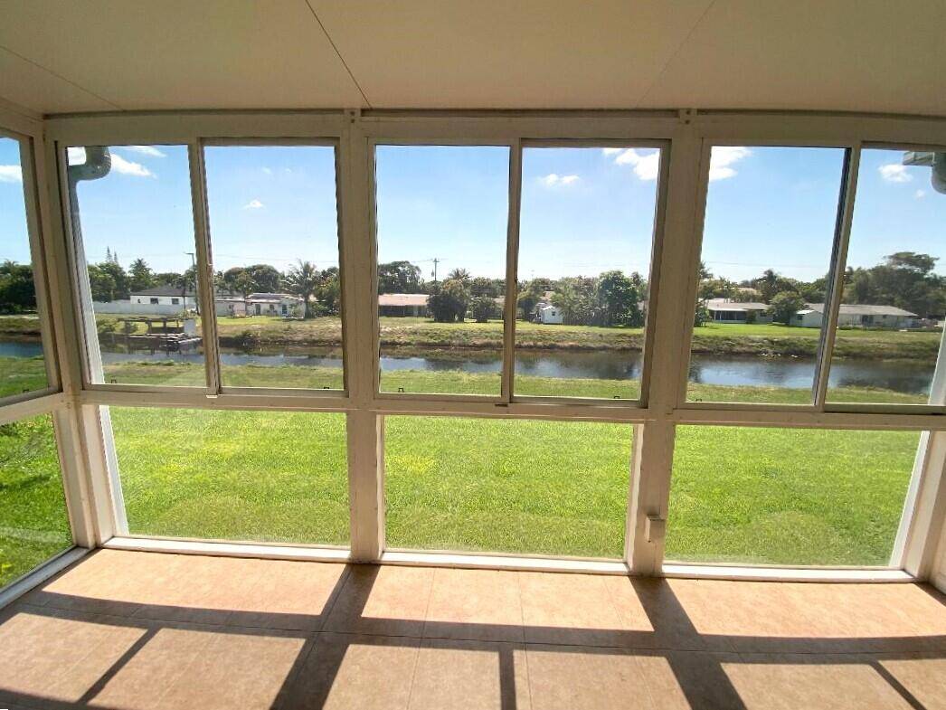 PINES OF DELRAY. Breezy east facing views overlook a serene canal in this 1167 sq ft 2 bedroom 2 bath residence that boasts a remarkable additional 160 square feet of ...