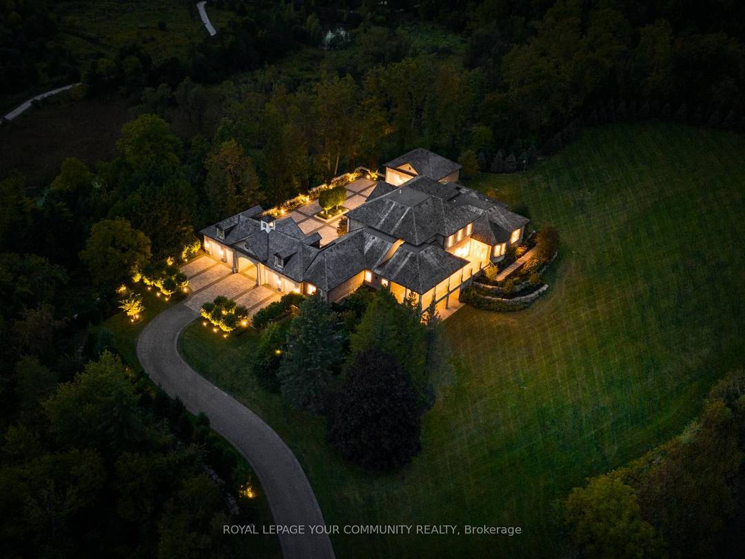 The Sanctuary ! Spectacular family compound and entertainers estate on 35 acres with private 15 acre spring fed pond.