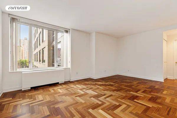 Very spacious Alcove Studio with a large window.