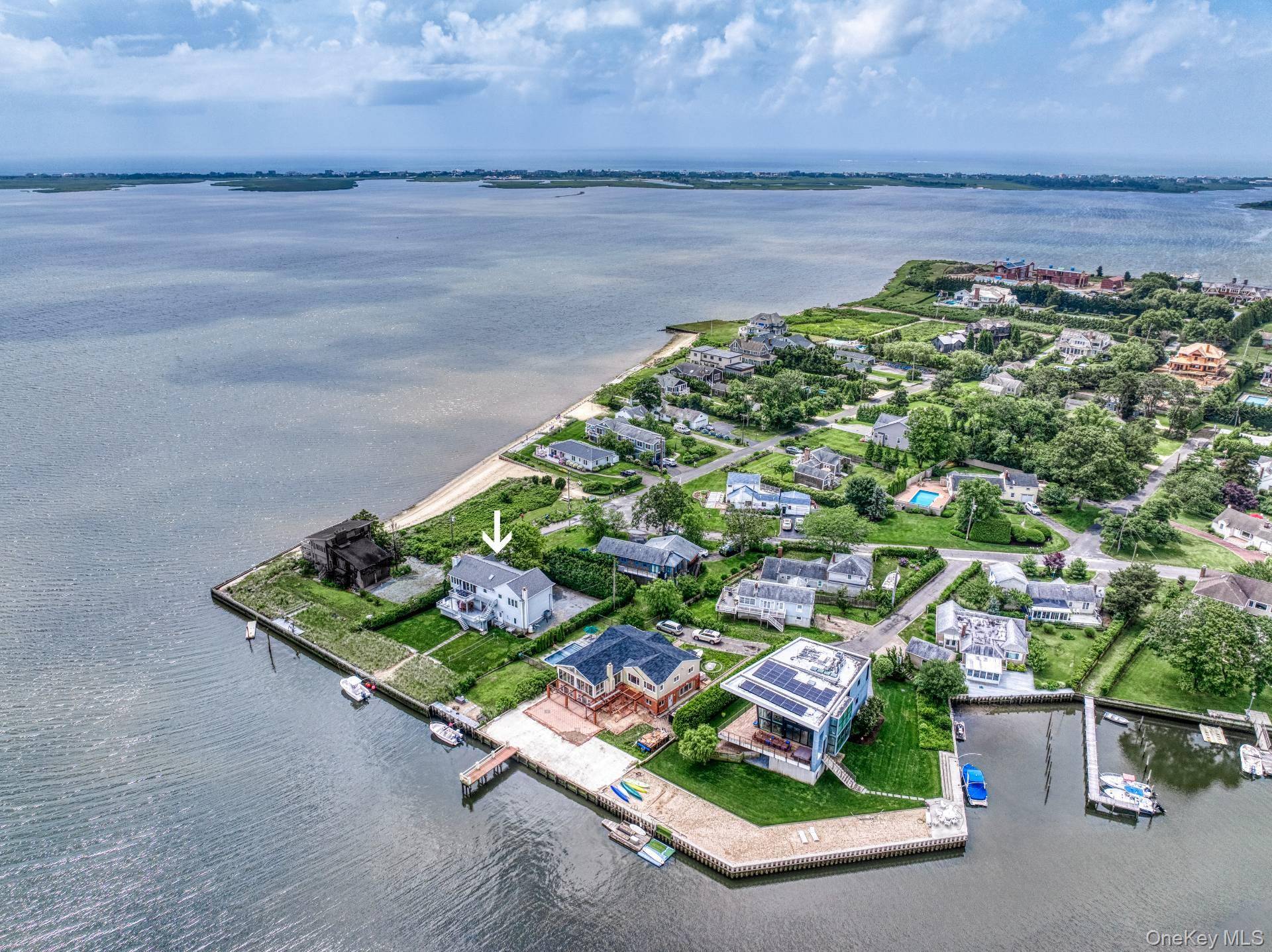 Waterfront Beach House Shinnecock Bay, East Quogue Nestled along the shimmering shores of Shinnecock Bay, this stunning two story beach house boasts panoramic water views to the east, south to ...