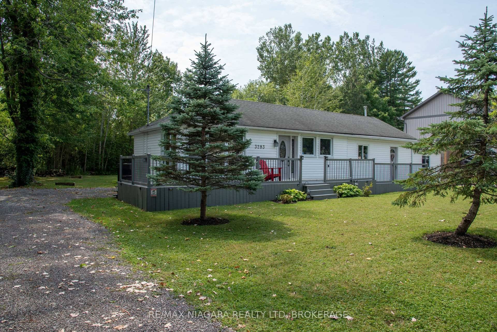 Tastefully updated 1372 sq ft move in ready ranch bungalow on a spacious 105 x 150 ft private lot backing on to the Friendship Trail in Ridgeway.