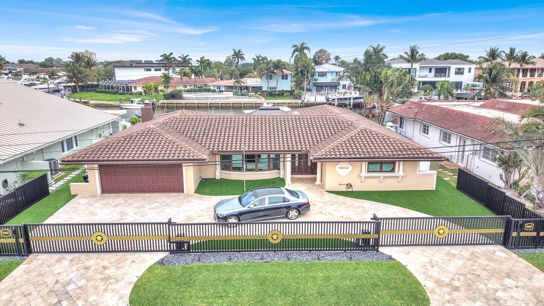 Indulge in the pinnacle of South Florida waterfront living with this exceptional 3 bedroom, 3 bathroom residence in the prestigious enclave of Venetian Isles of Lighthouse Point.