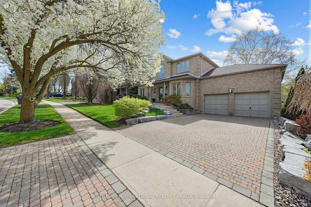 Distinguished ravine residence backing onto the Credit River in the exclusive Credit Pointe enclave.