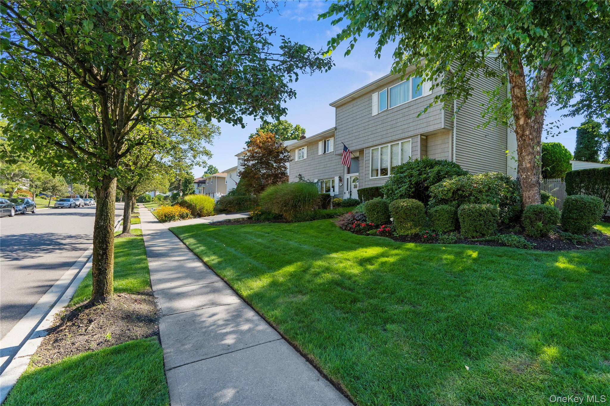 Tucked away on a quiet mid block in a well established neighborhood, this expanded split level home offers a perfect blend of classic charm and modern comfort.
