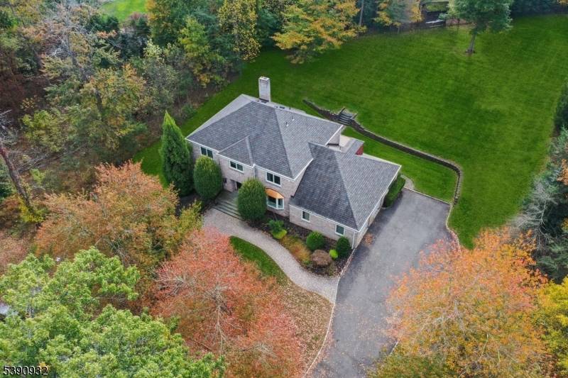 STATELY ELEGANCE EXPANSIVE PROPERTY Welcome to this stunning, modern brick Colonial, perfectly set atop 0.