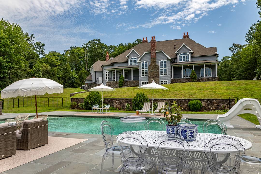 Long gracious driveway leads you to the formal yet comfortable country house set privately on the property for peaceful enjoyment.