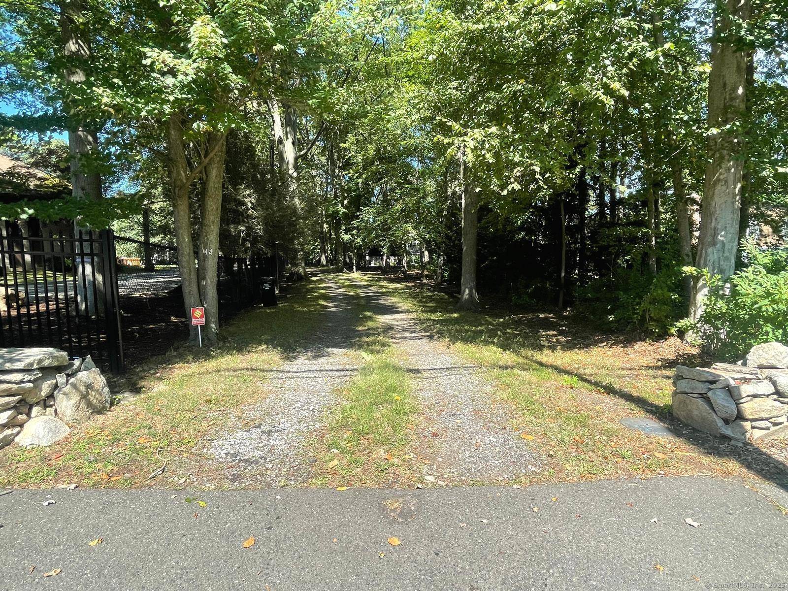 Tucked away in highly sought after Norwalk Westport line location, this lovely Colonial sits on.