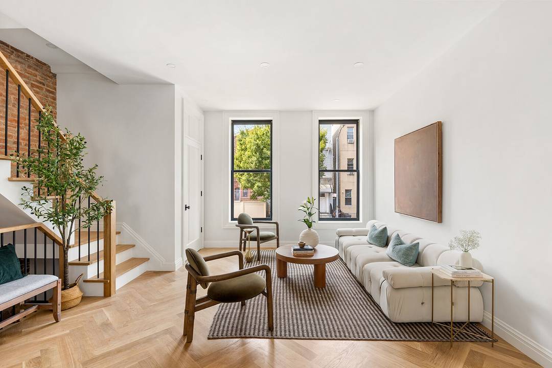 Built in 1910 and fully renovated in 2025, this stunning two family townhouse offers a blend of pre war charm and modern finishes.