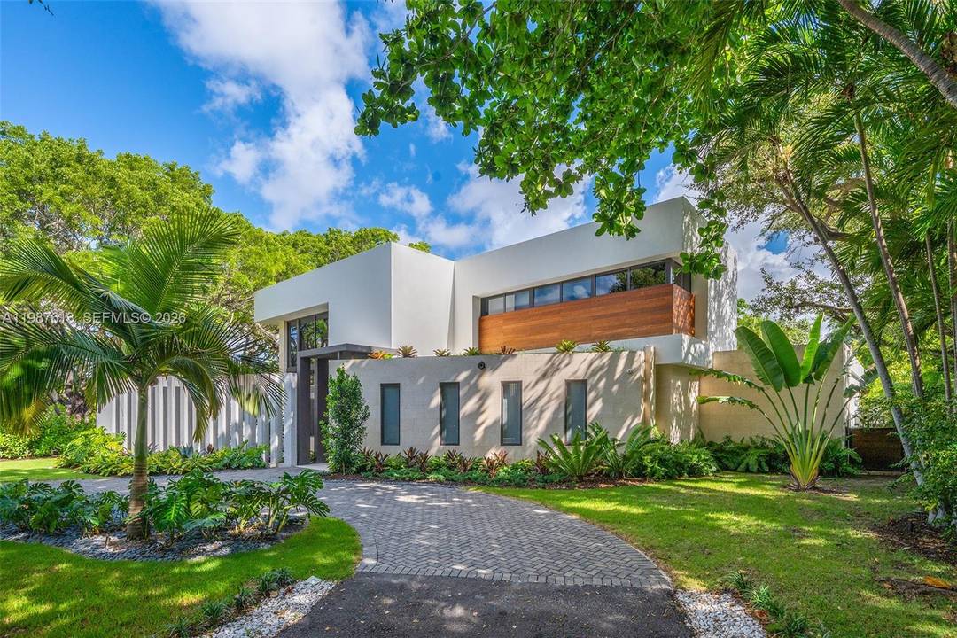 This luxurious 5 bedroom, 6 bath Florida Modern residence boasts over 5, 500 square feet of elegantly designed indoor and outdoor living space, nestled among lush tropical landscaping for ultimate ...