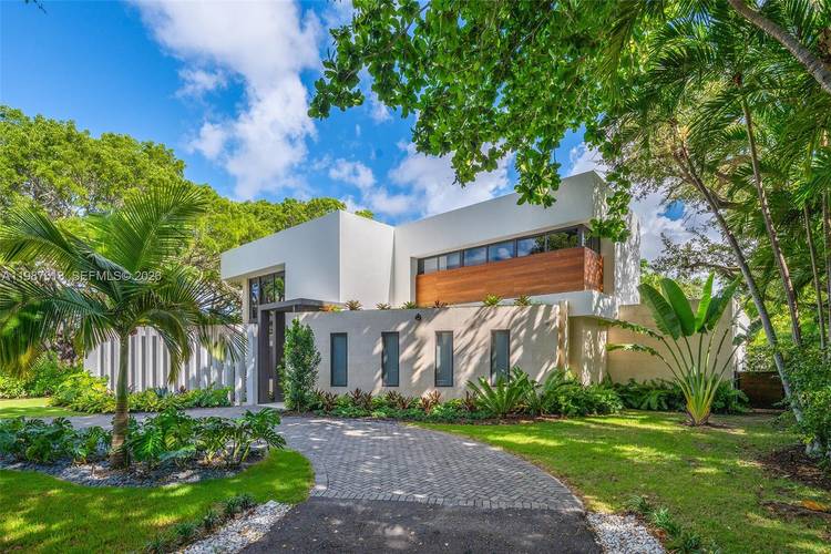 This luxurious 5 bedroom, 6 bath Florida Modern residence boasts over 5, 500 square feet of elegantly designed indoor and outdoor living space, nestled among lush tropical landscaping for ultimate ...