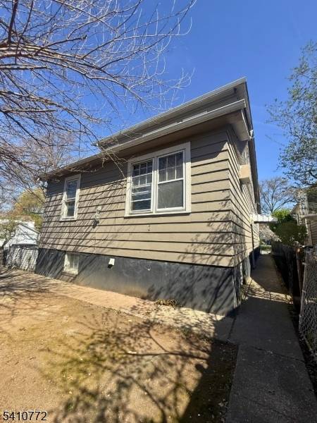 Opportunity knocks in desirable Maplewood with this 2 family fixer upper w 6 rooms and 2.