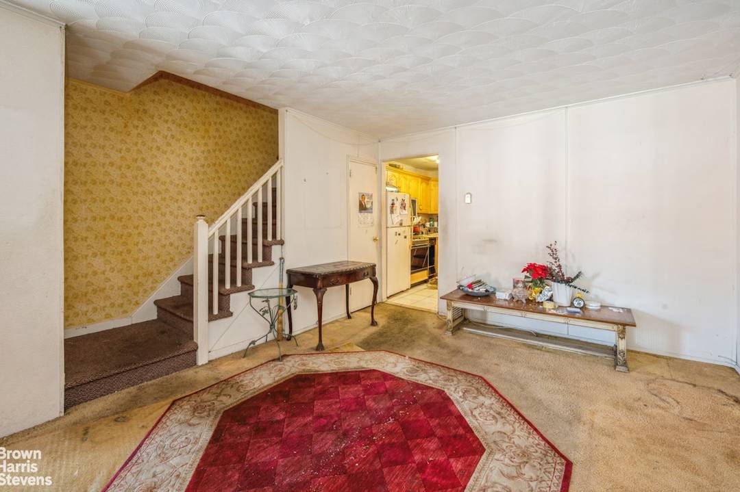 Attached single family home available for sale AS IS.