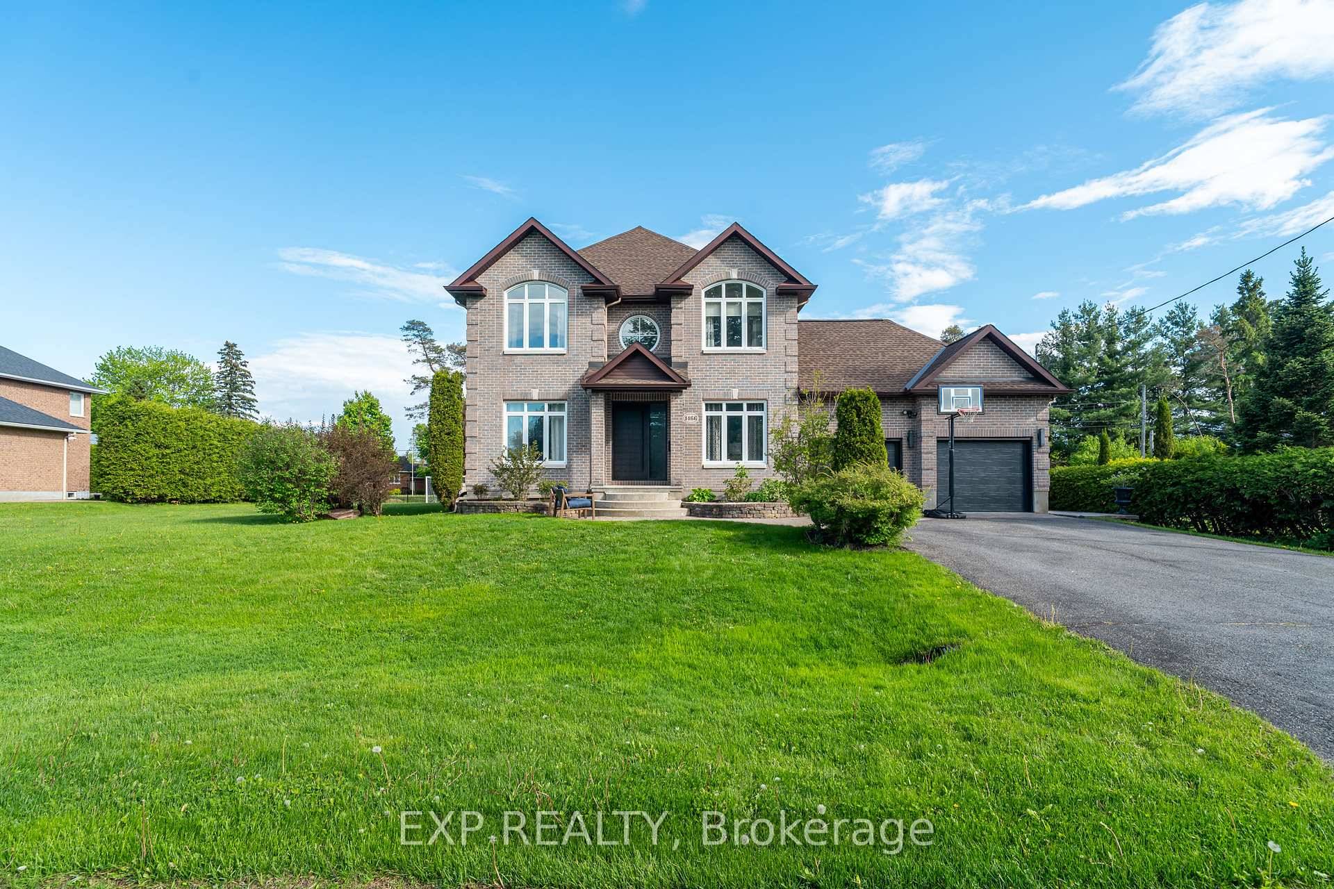 Welcome to 1466 Rhea, a thoughtfully designed custom built home nestled on a rare double lot, offering space, privacy, and the potential to sever.