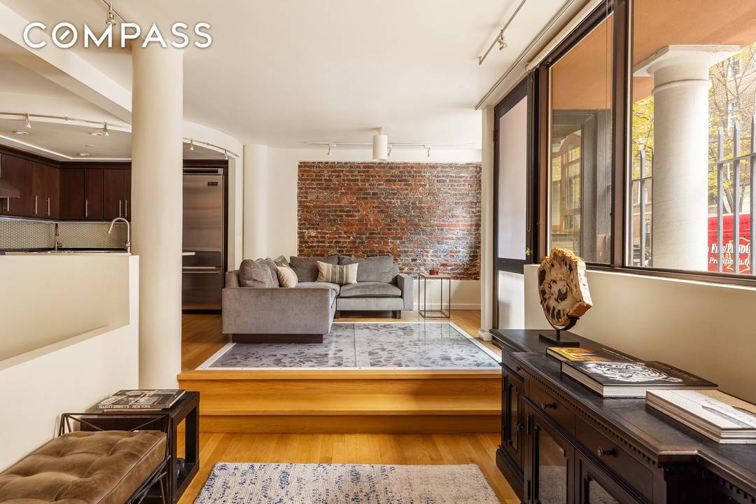 Set along a cobblestone street, just one block from Hudson River Park, 357 West 12th St, Residence 1E is an over 1, 800 square foot duplex composed for modern living.