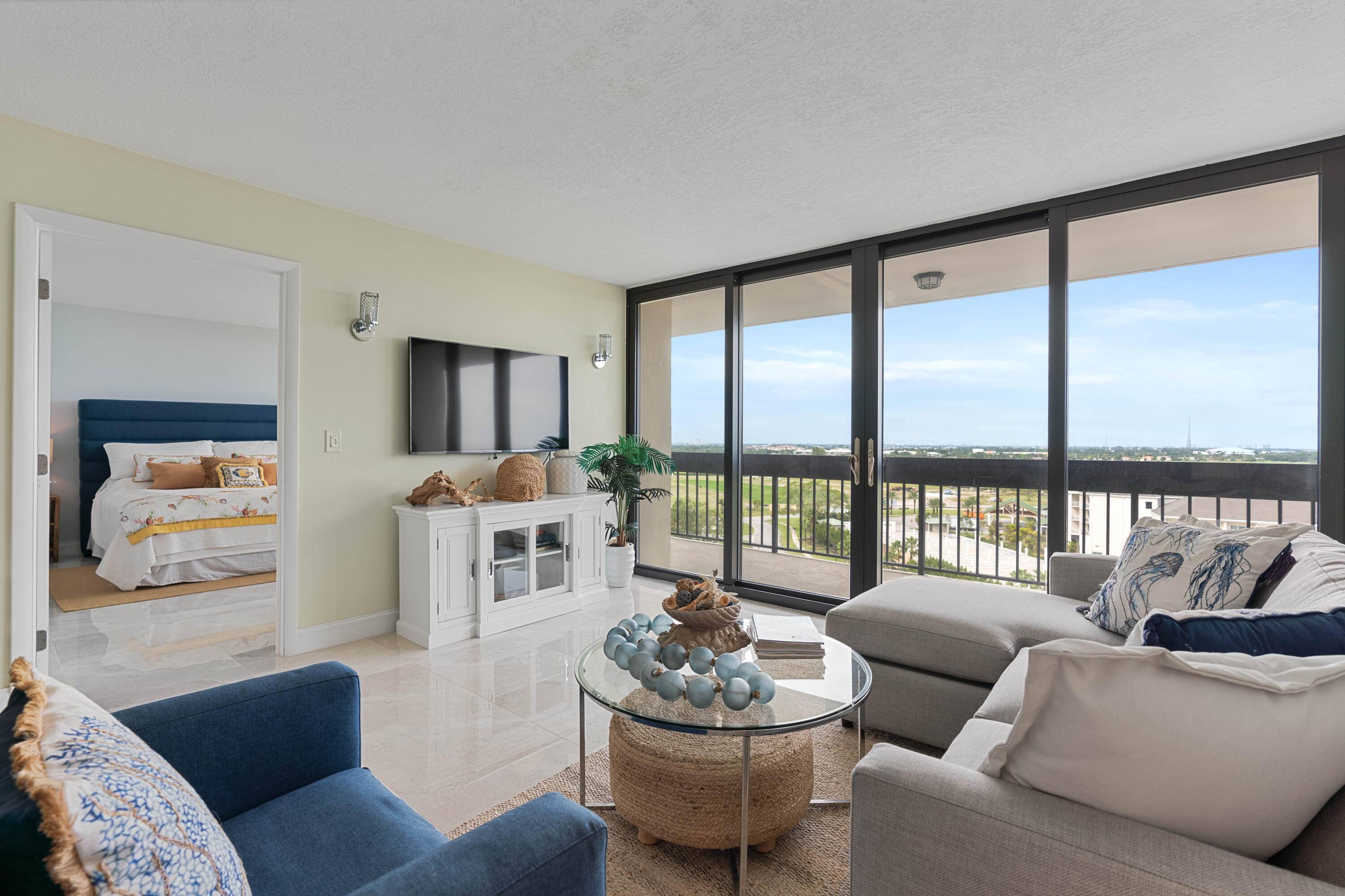 Completely renovated 2 Bedroom 2 Bath middle building unit with spacious balcony overlooking the Nicklaus design Banyan Cay Golf Course and Resort and Lake Mangonia.