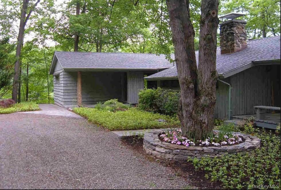 Private Hudson Valley Sanctuary Tucked away on over 24 acres of wooded beauty with tranquil water views and a private pond, this one of a kind 3 bedroom, 2.