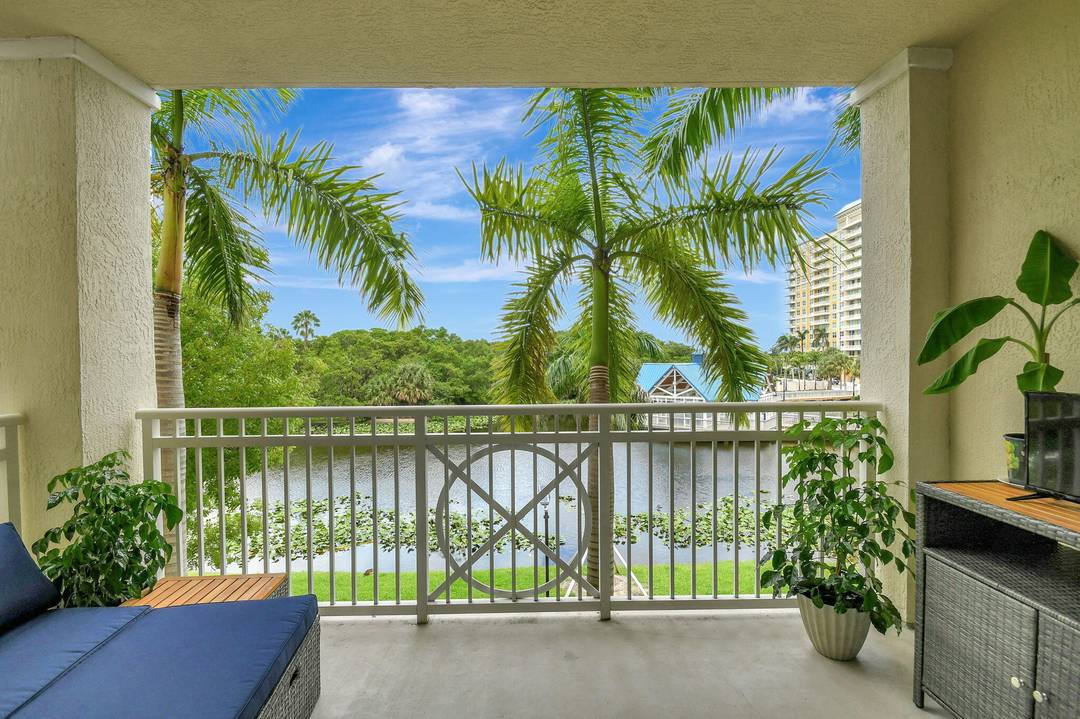 Wake up to beautiful sunrises and tranquil lagoon views from this immaculate multi level townhome with stairs.