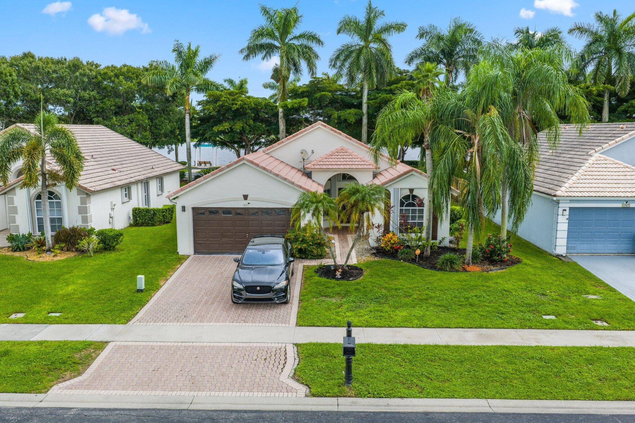 Charming pool home in the desirable Wellington's Edge !