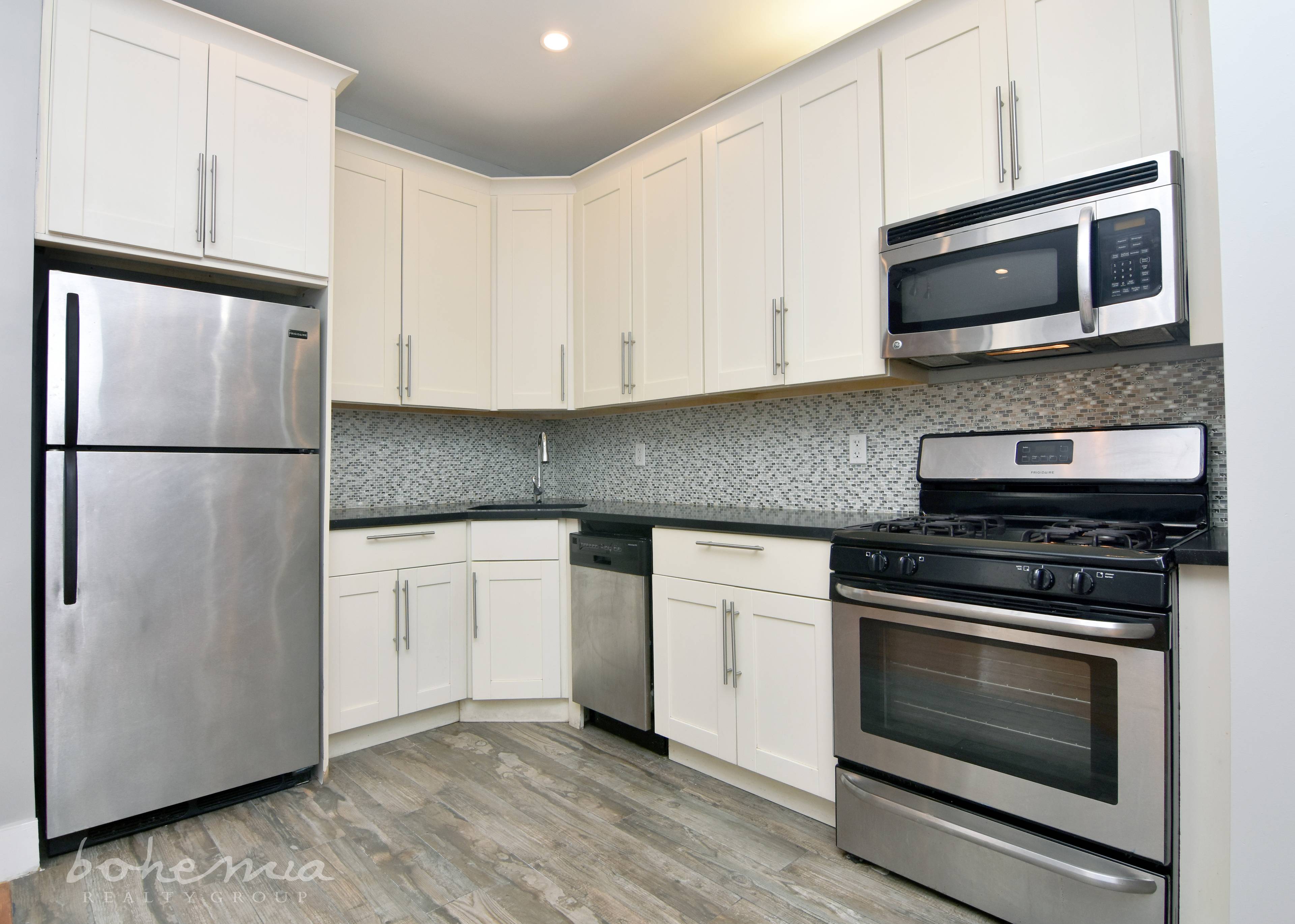 3 bedroom, 1. 5 bath. Beautiful corner kitchen full of white cabinets Stainless steel appliances including a Microwave amp ; a Dishwasher, ELEVATOR !
