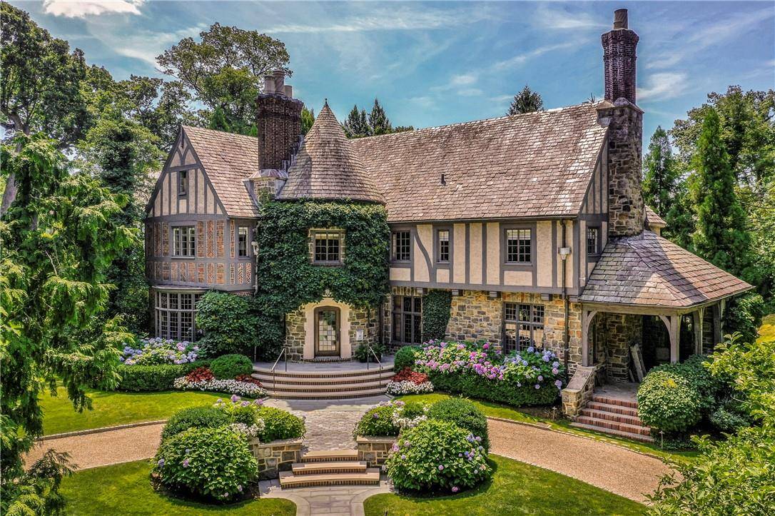 A majestic move in ready French Normandy Tudor that boasts tremendous flexibility in layout, adaptable spaces and every modern convenience.