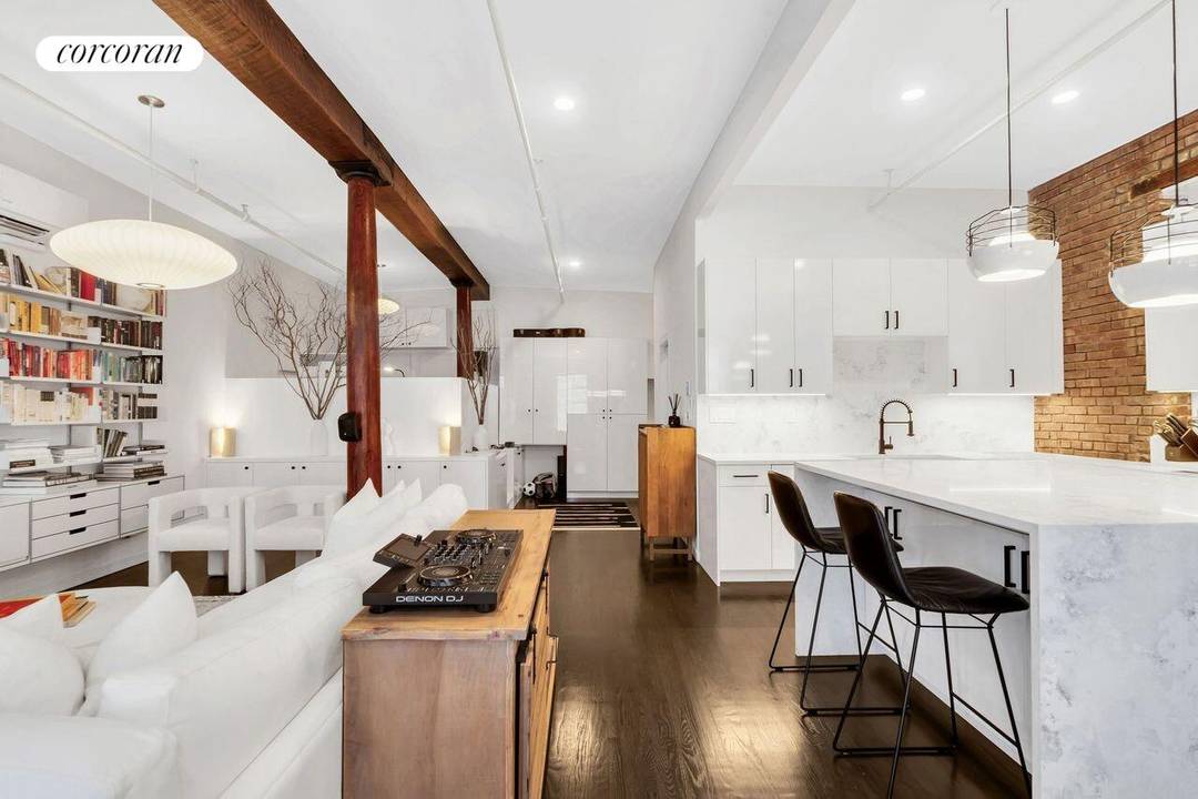 A meticulously gut renovated one bedroom loft in the heart of Soho, perfectly blending historic charm with modern luxury.