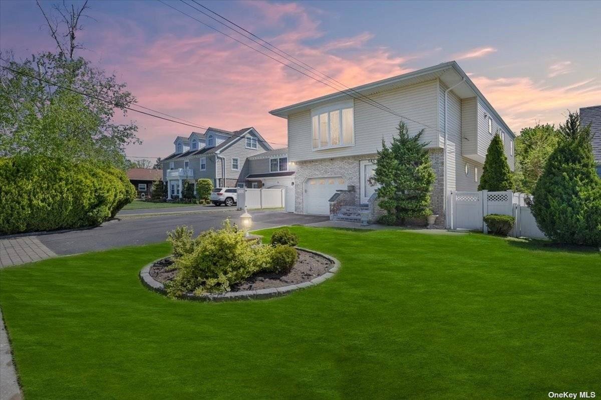 Nestled in The Picturesque Community of East Rockaway This Charming Hi Ranch Set On Oversized 50x147 Lot With Over 2300 Sq Ft Of Living Space.