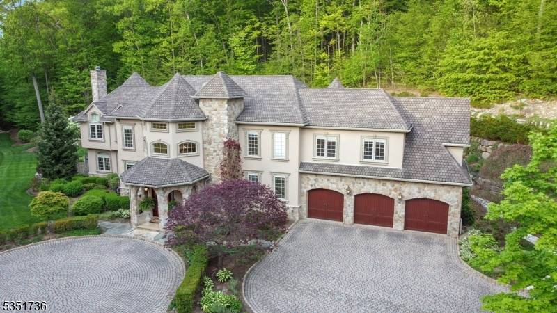 Nestled against the breathtaking backdrop of Ramapo Mountain State Forest, this exceptional 10.