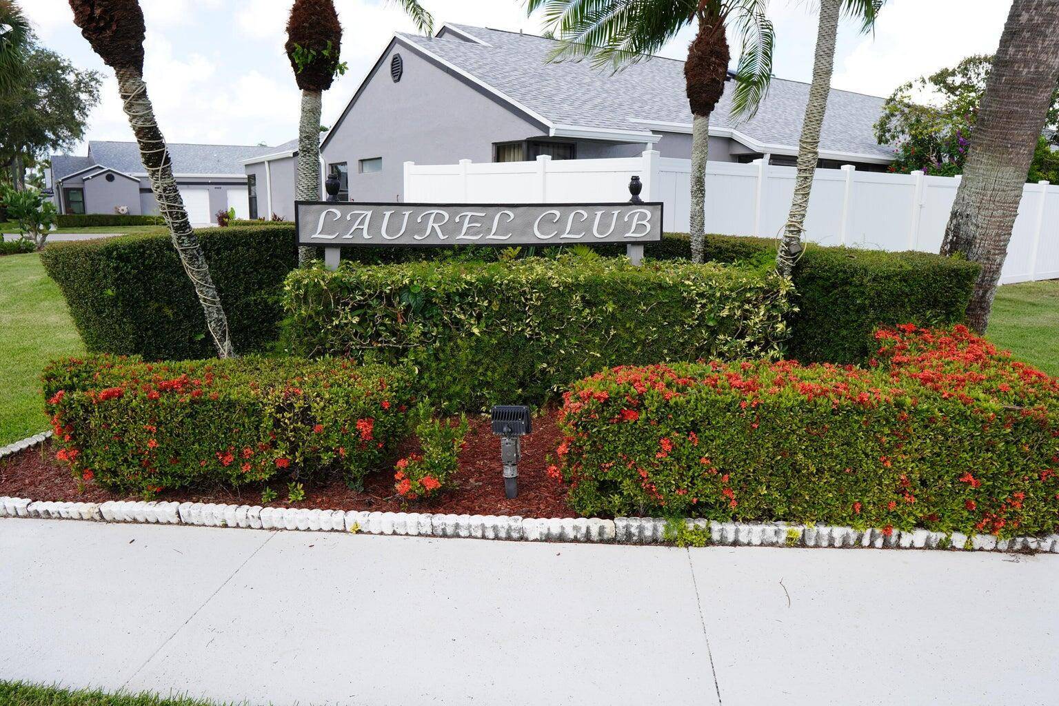 Charming three bedroom, two bath villa with a one car garage and extended driveway on a corner lot in the highly sought after Laurel Club community.
