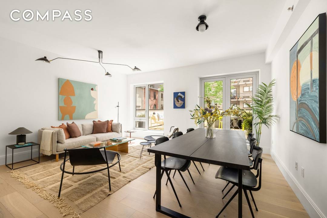 A sun filled, impeccably finished three bedroom, two and a half bathroom condominium with a true private outdoor extension, plus the rare bonus of a parking space and storage.