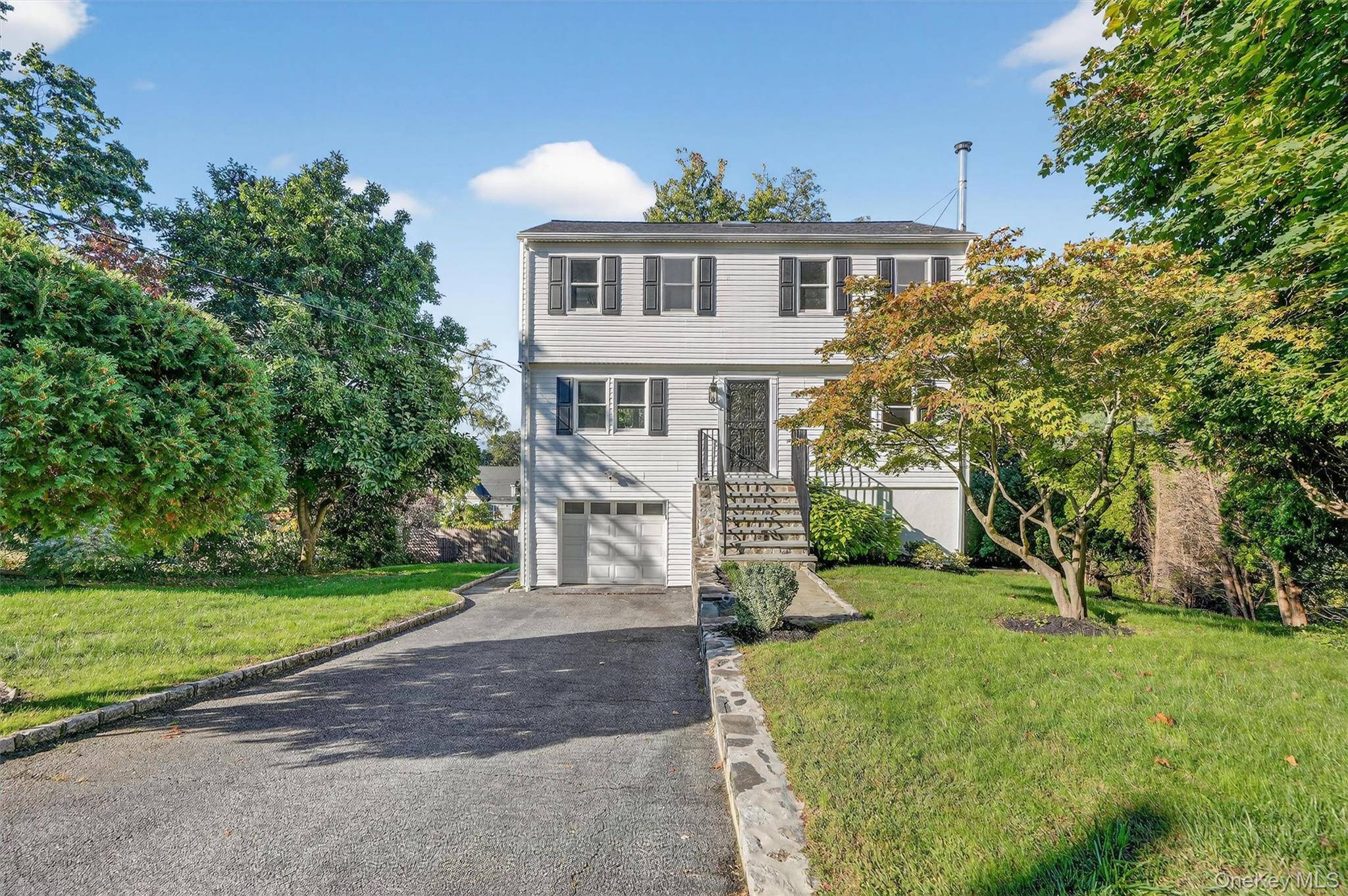 Welcome home to this impeccable turnkey residence on a quiet, tree lined street a home that s been completely gut renovated and finished to perfection.