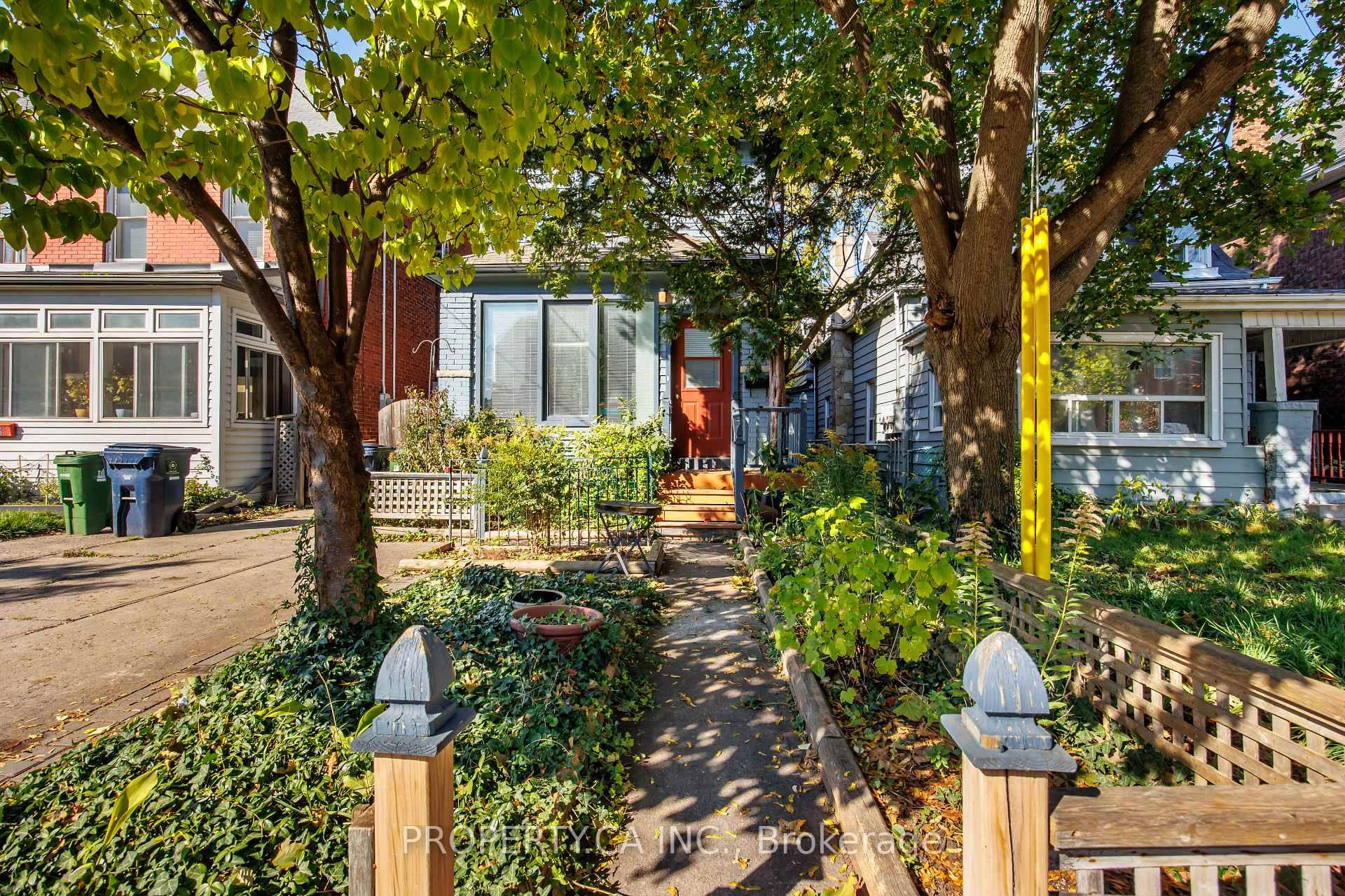 Sun filled detached 2 storey home a true cottage in the city featuring an expansive backyard and a bright sunroom overlooking the decked yard.