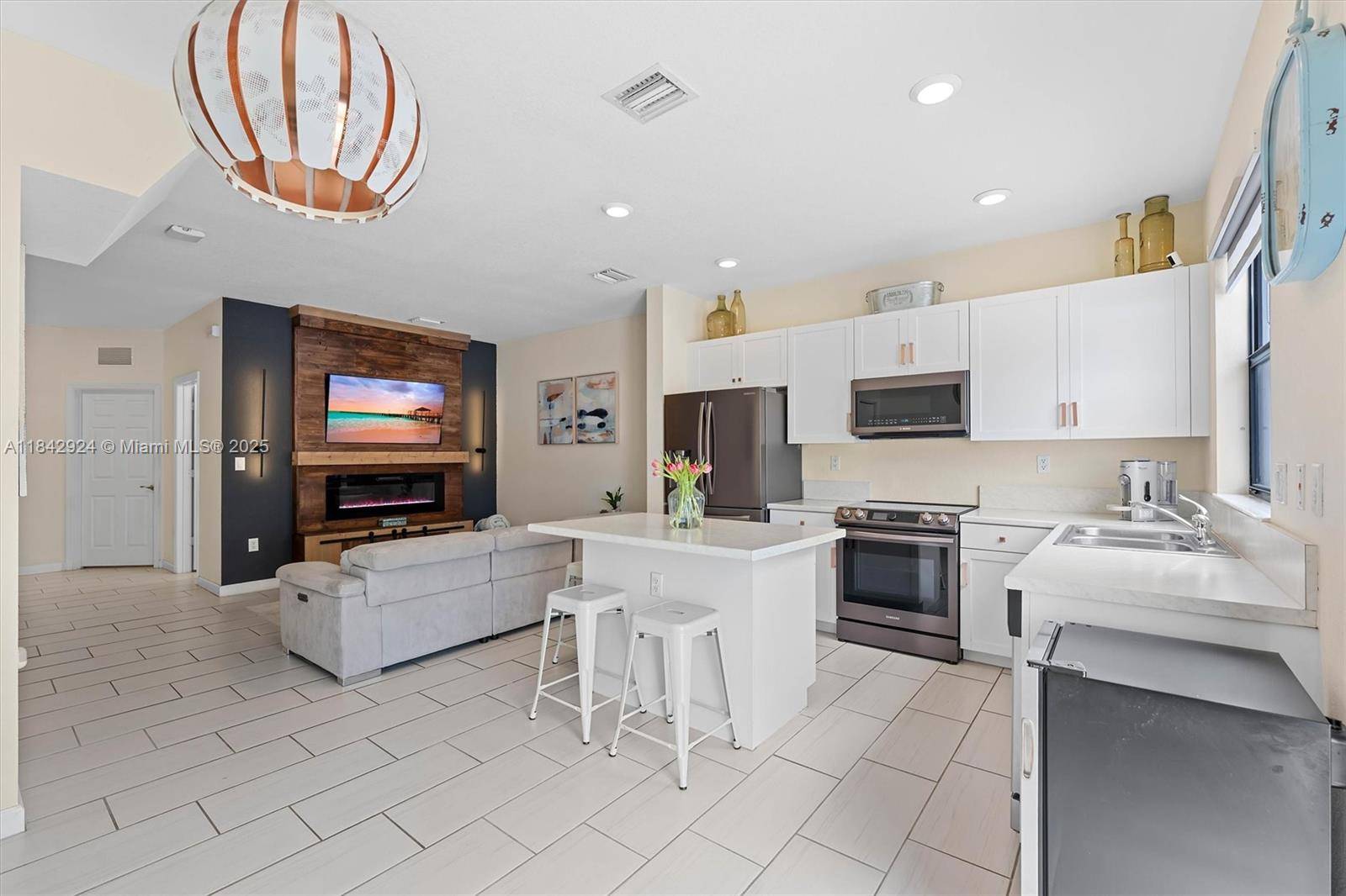 Welcome to this beautifully maintained 3 bed, 3 bath townhome in the gated, resort style community of Aquabella !