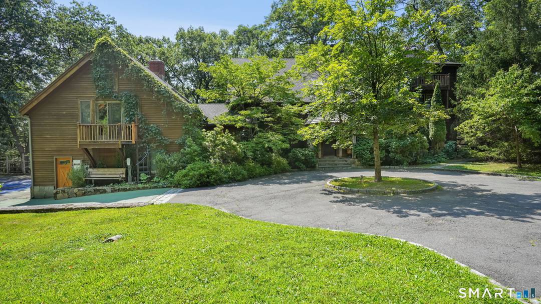 Privately nestled on over three spectacular acres, this exceptional 5 bed 4 bath estate delivers a lifestyle rarely found in Fairfield County.