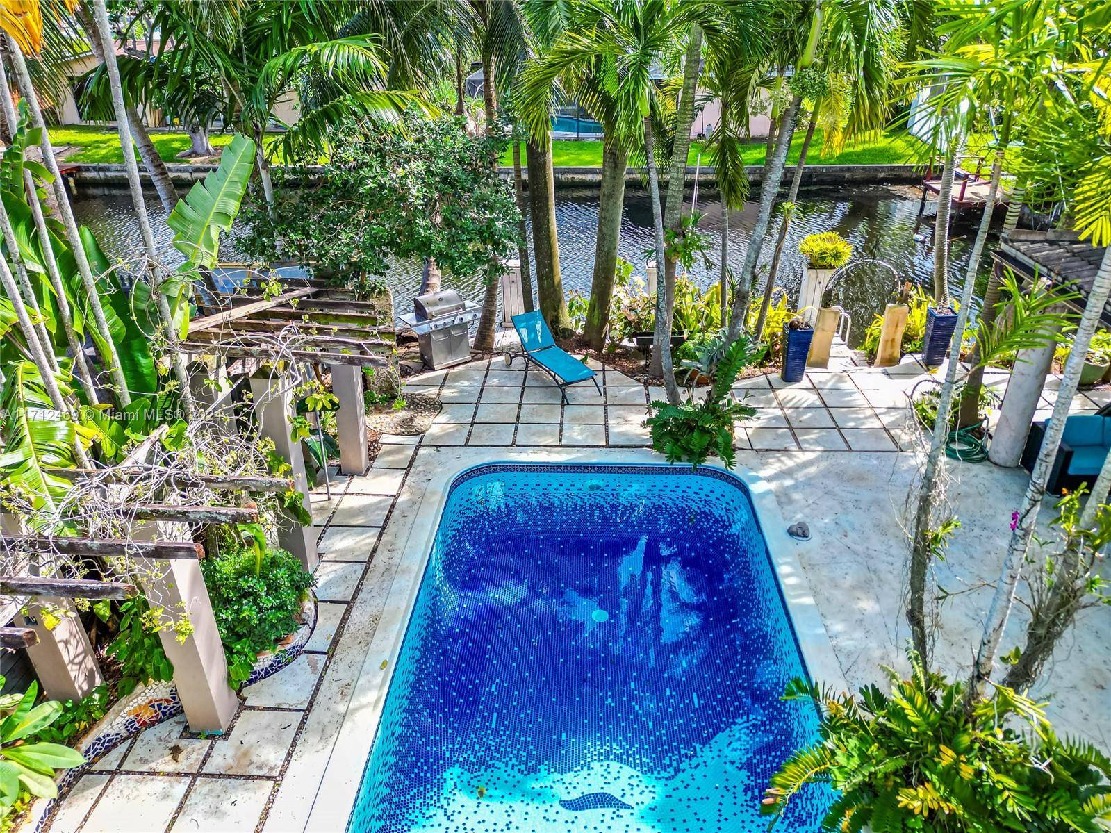 Unique style house with water access and private dock, this house has 2 bedrooms and a 3rd bedroom converted into a TV room, a large dining room with a garden ...