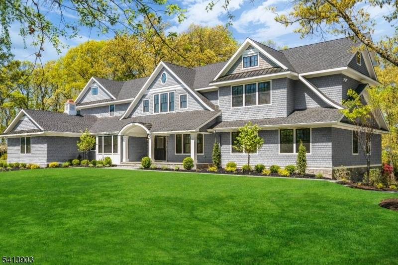 New from the ground up blended with refined modern touches, this expansive 7 bedroom home with 6 full baths and 2 half baths delivers grandeur and comfort.