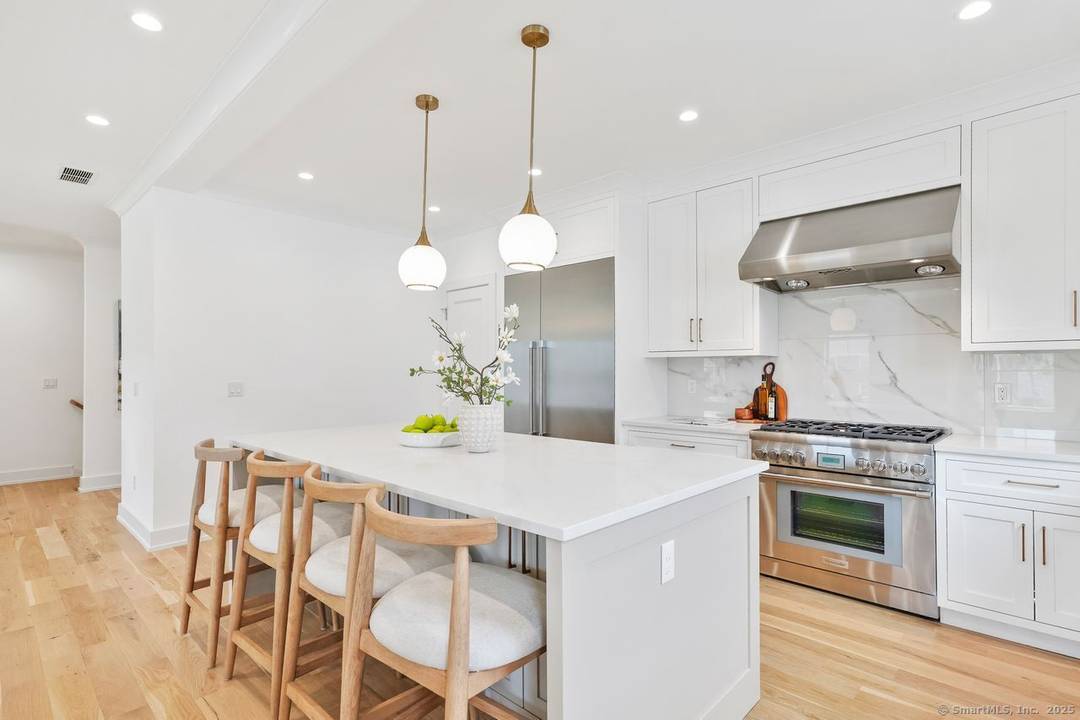 Approximately 4, 000 square feet townhouse feels like a single family home with thoughtfully designed living space and featuring four bedrooms, four en suite bathrooms, and two half baths, and ...