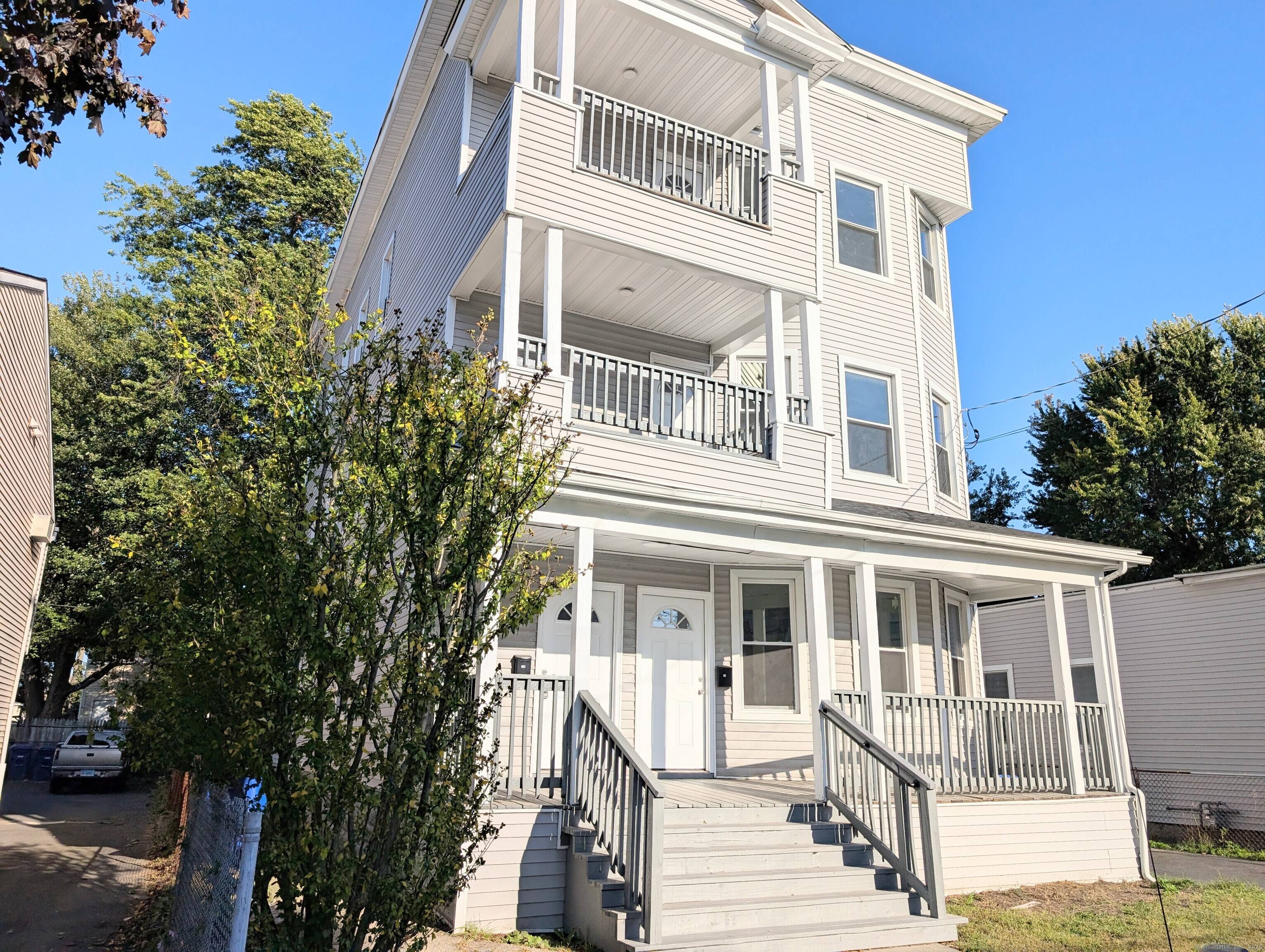 Completely renovated 3 family home with a 2 car detached garage has been rebuilt from the studs up with luxury finishes and modern design delivering the look, feel, and quality ...