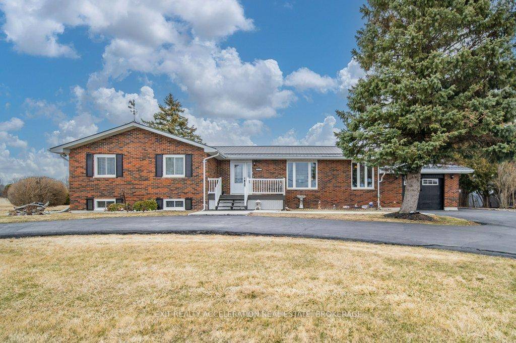 This beautifully maintained four bedroom, three bathroom brick home sits on a generous 0.