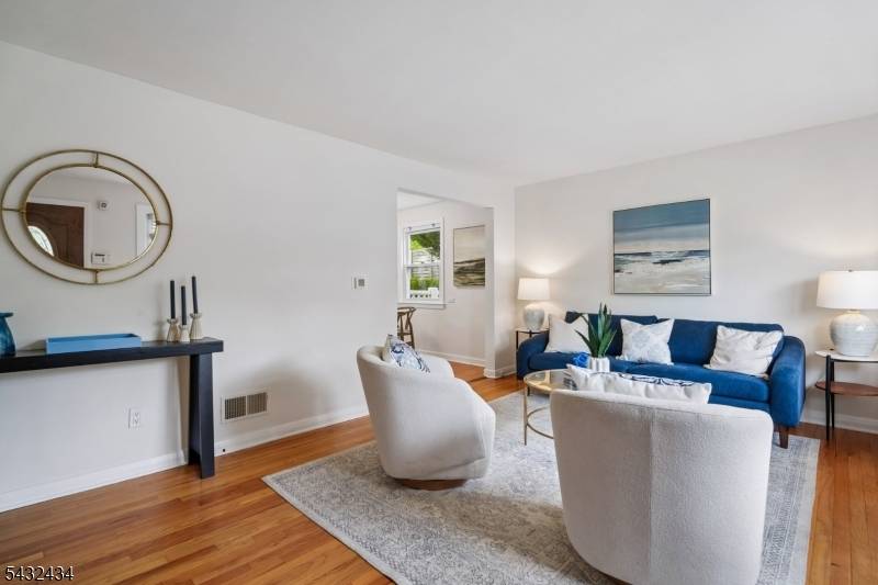 Welcome to this charming Cape nestled in Bloomfield's beloved Oakview community.