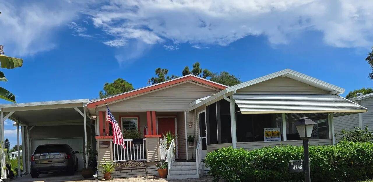 BRAND NEW ROOF 350 Ft INTEGRAL GARAGE with 15 x 4 built in work bench Automatic Door, Craft room complete with shelving, 3 bedrooms 2 baths, screened in front porch ...