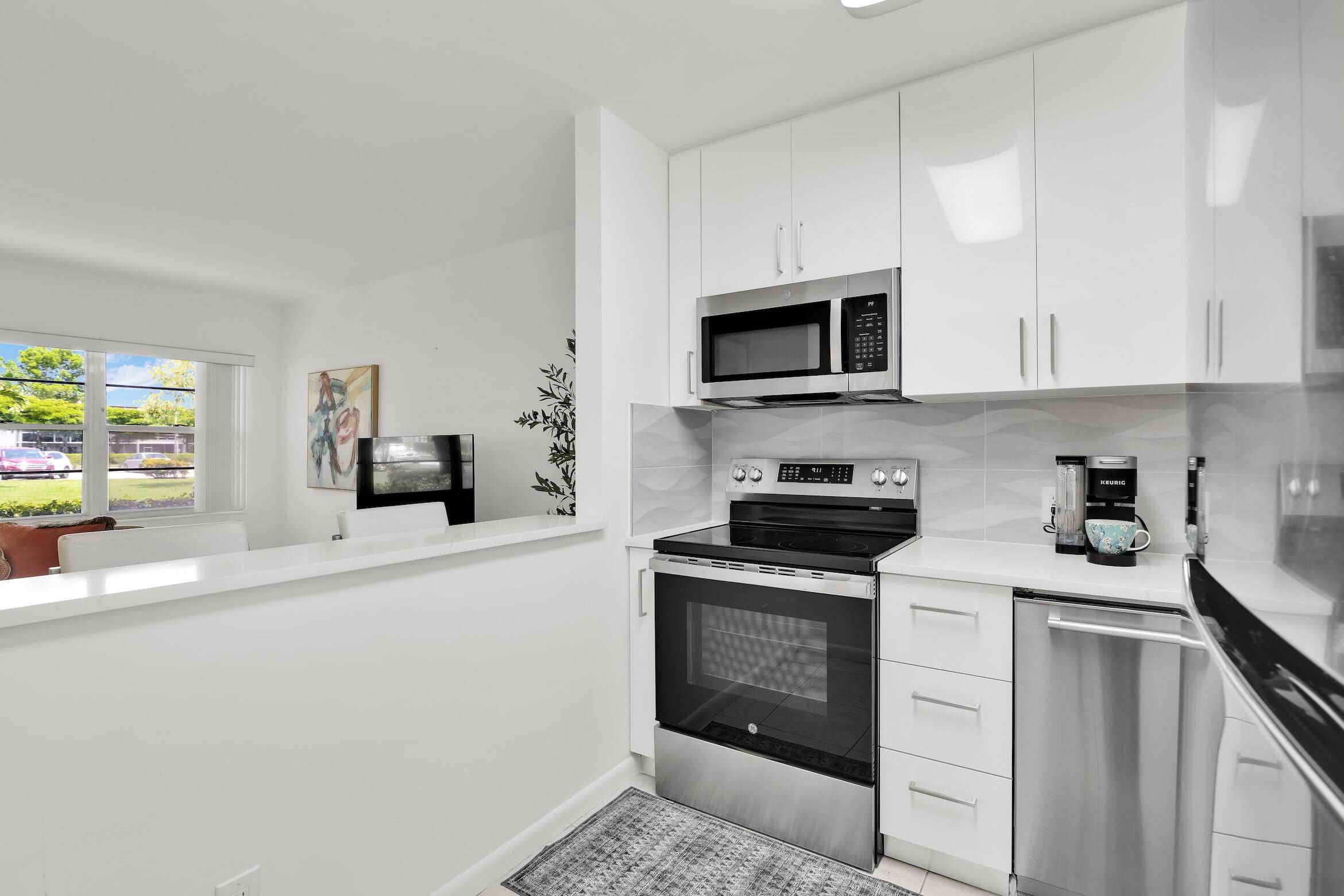 Beautiful first floor unit with stunning lake views and renovated with impeccable finishes.