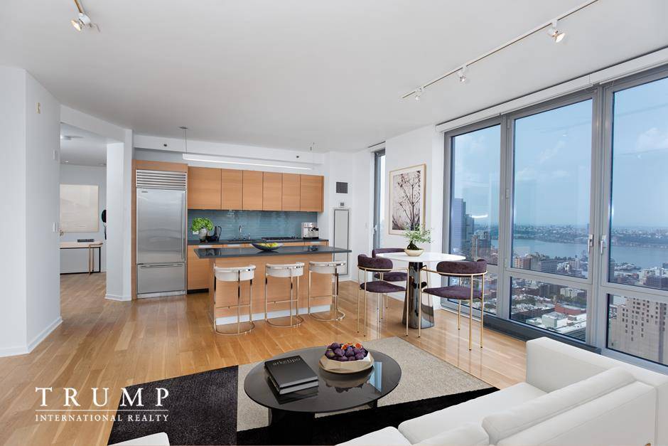 Enjoy jaw dropping panoramic views of the city, river and Central Park two floors off the top of the building from this triple mint home with floor to ceiling windows.