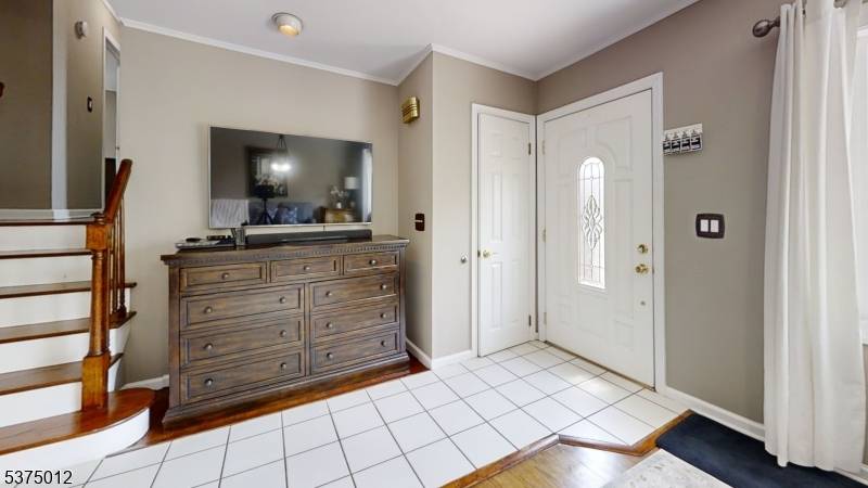 Split Level Home with Spacious Back AdditionThis highly sought after home features a generous in law suite with its own summer kitchen, living room, full bath, and ground level room.